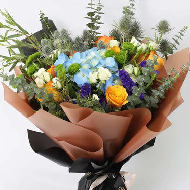 Floral Forest Bouquet, Blue Hydrangea, Orange Roses, White Baby Roses, Eryngium